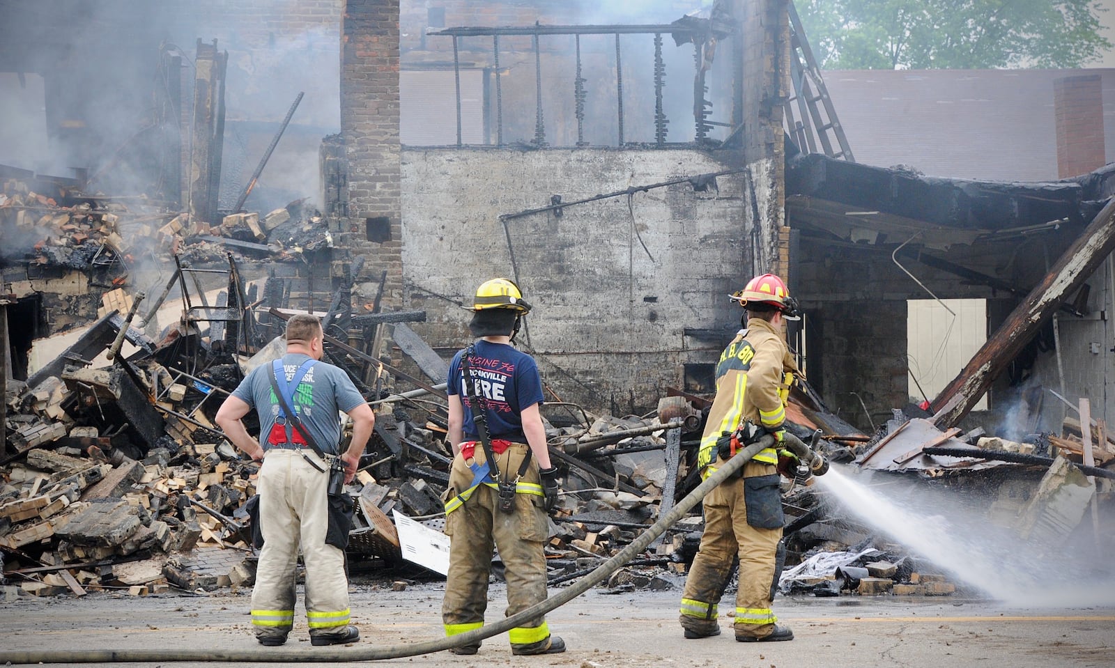 Demolition has begun at the intersection of National Road and Arlington Road Tuesday, July 13, 2021, after a truck crashed into a business, catching both on fire. According to the owner of the business he plans to stay open. MARSHALL GORBY\STAFF