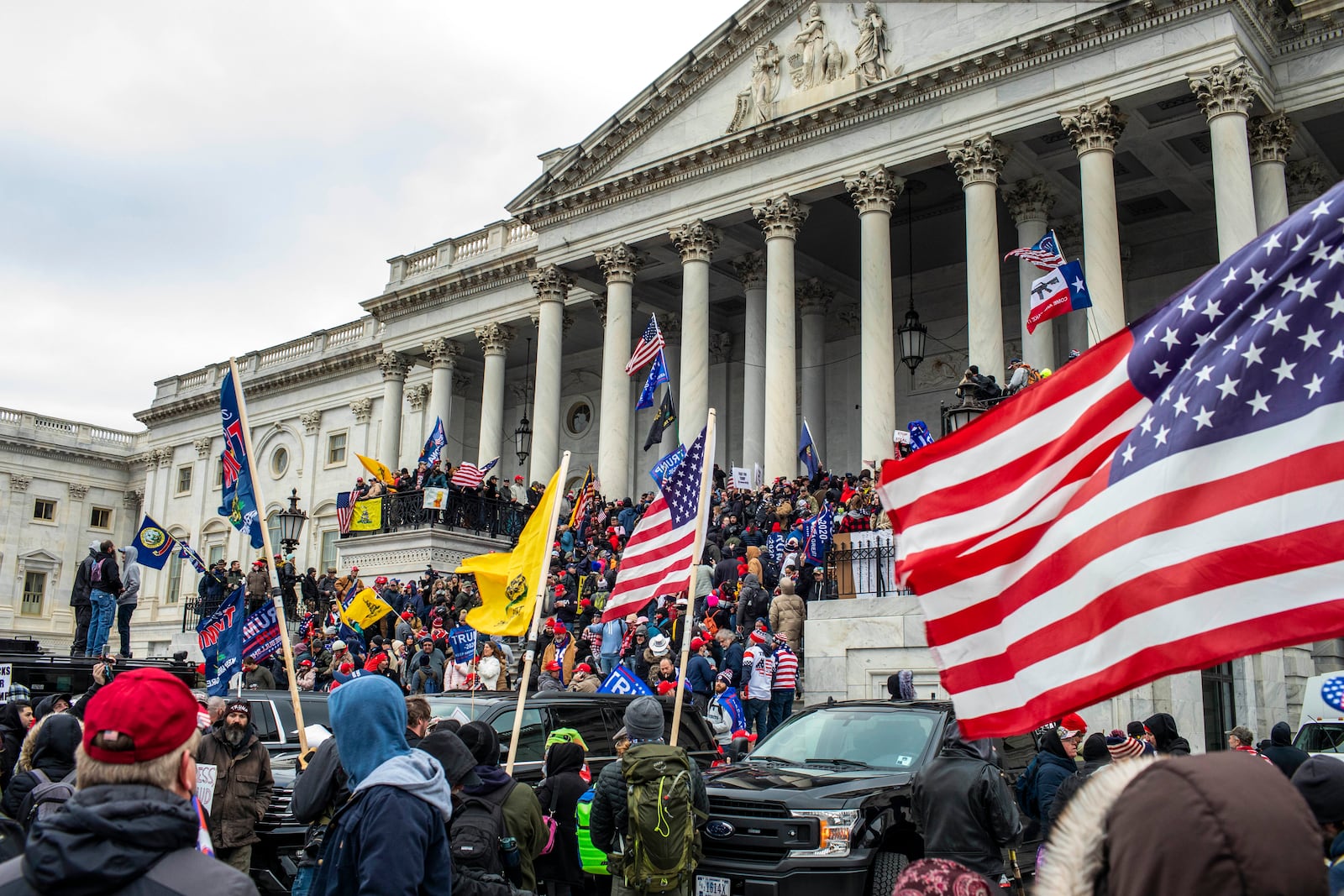 
                        FILE — Supporters of then-President Donald Trump storm the Capitol in Washington on Jan. 6, 2021, as members of Congress prepare to count electoral college votes and certify Joe Biden’s victory in the presidential election. (Jason Andrew/The New York Times)
                      