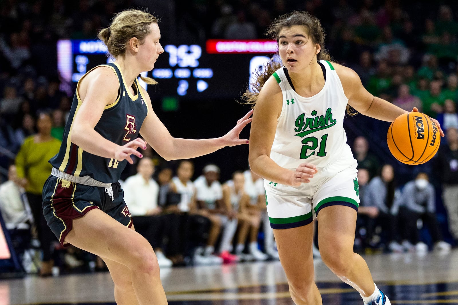 Notre Dame's Maddy Westbeld (21) works against Boston College's Ally VanTimmeren (12) during the first half of an NCAA college basketball game Sunday, Jan. 1, 2023 in South Bend, Ind. (AP Photo/Michael Caterina)