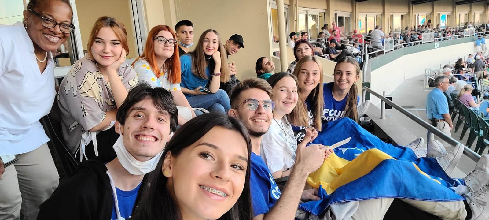 Cherise Hairston of The Dayton Mediation Center (left) hosted students from Bosnia and Herzegovina at a Dayton Dragons game in 2021.