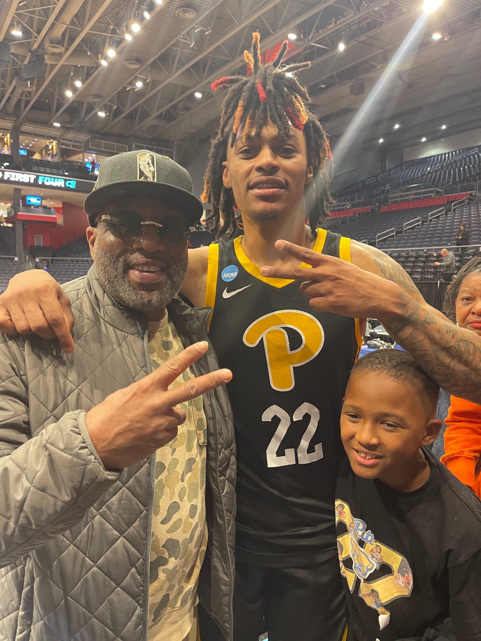 After Pittsburgh's victory over Mississippi State in the First Four on Tuesday night, March 14, 2023, at UD Arena, Panthers guard Nike Sibande met with his family and friends in the stands including Eric Burnes (left) and Nike’s nephew Jeremiah. CONTRIBUTED