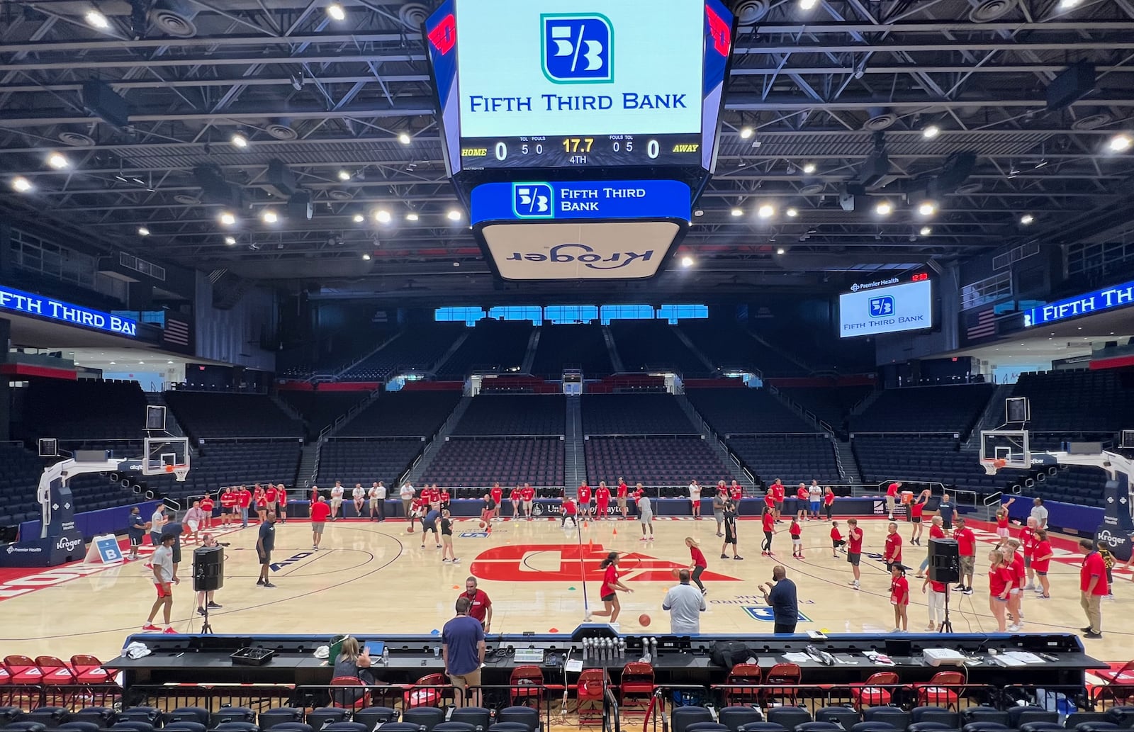 Dayton players work with kids at a basketball camp at UD Arena. Contributed photo