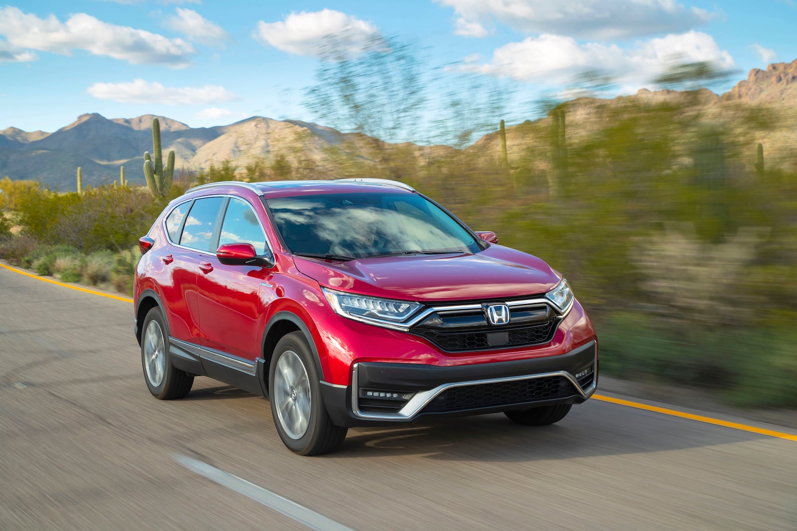 This photo provided by Honda shows a 2021 Honda CR-V Hybrid, an all-wheel-drive hybrid crossover SUV. (American Honda Motor Co. via AP)