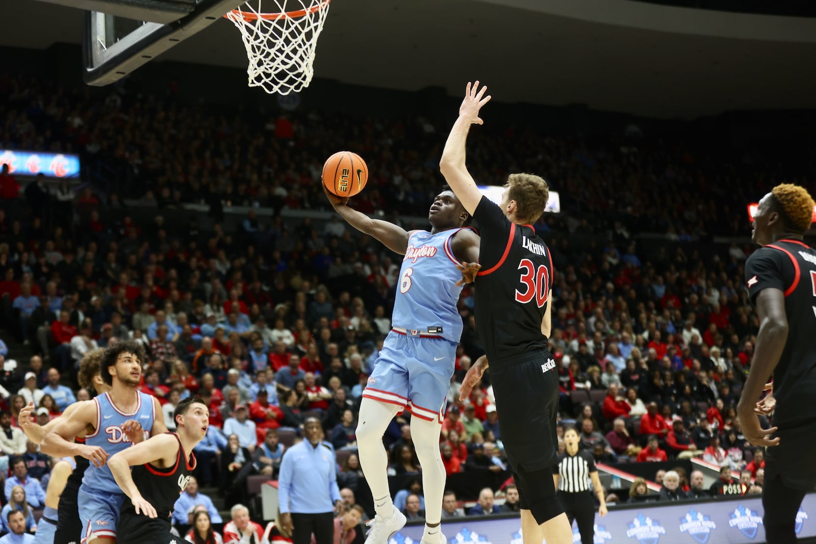 Dayton's Enoch Cheeks shoots against Cincinnati on Saturday, Dec. 16, 2023, at the Heritage Bank Center in Cincinnati. David Jablonski/Staff