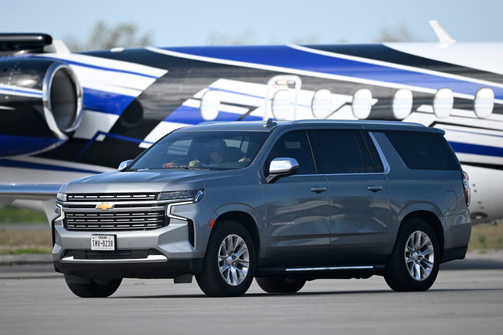 A vehicle carrying Leonard Peltier arrives at Leesburg International Airport after being released from the Federal Correctional Complex, Coleman, Tuesday, Feb. 18, 2025, in Leesburg, Fla. (AP Photo/Phelan M. Ebenhack)