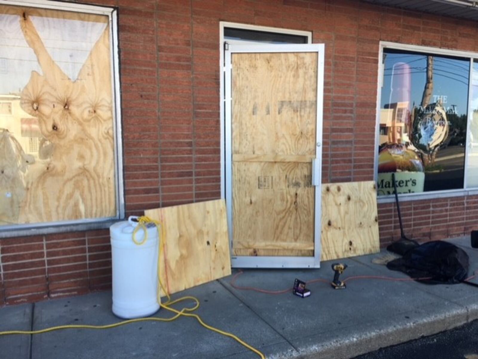 Belmont Party Supply boarded up after the break-in