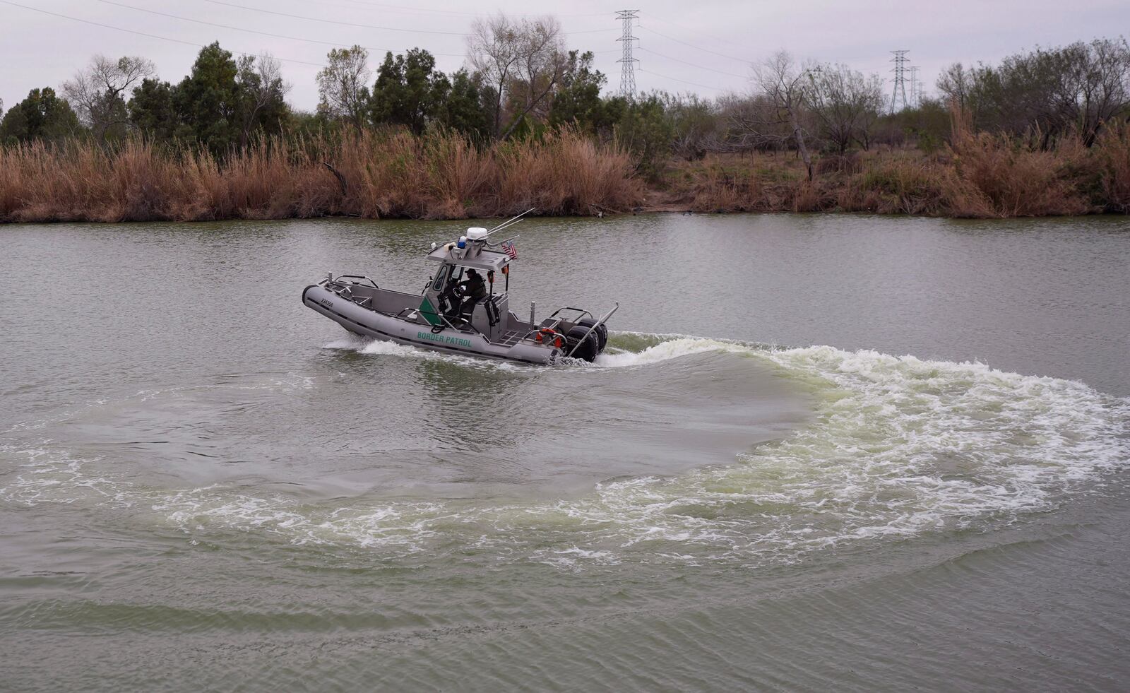 A border patrol agent prepares to patrol along the Rio Grande at the U.S.-Texas border, Thursday, Feb. 13, 2025, in McAllen, Texas. (AP Photo/Eric Gay)