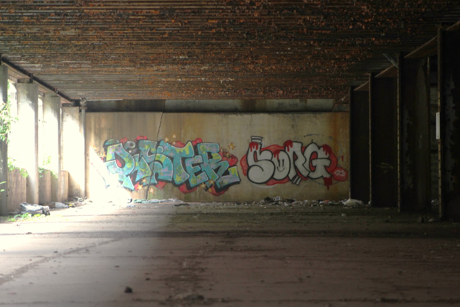 Graffiti tags underneath a rail overpass in downtown Dayton. CORNELIUS FROLIK / STAFF