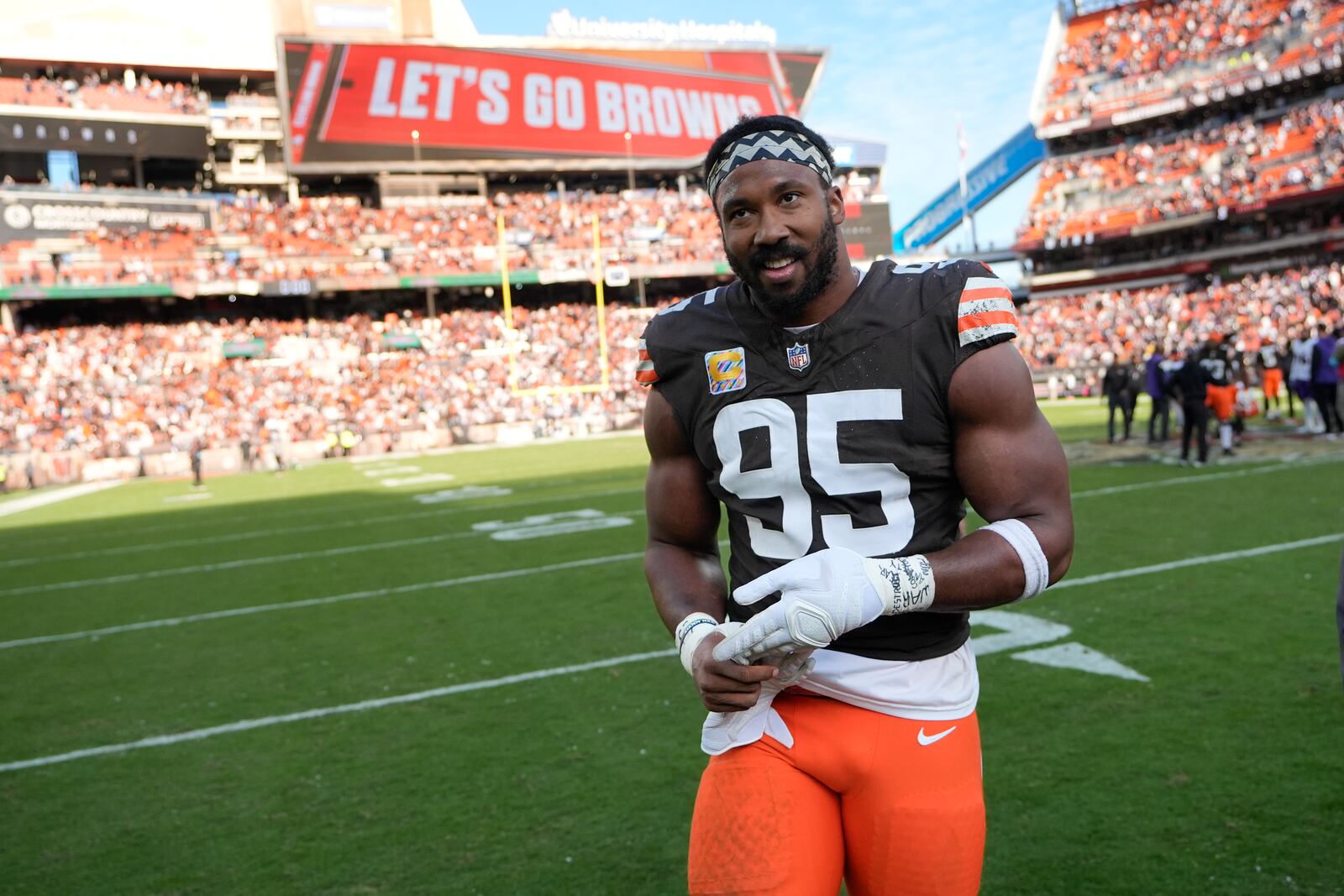 Cleveland Browns defensive end Myles Garrett (95) smiles as he come off the field following a game against the Baltimore Ravens in an NFL football game in Cleveland, Sunday, Oct. 27, 2024. (AP Photo/Sue Ogrocki)