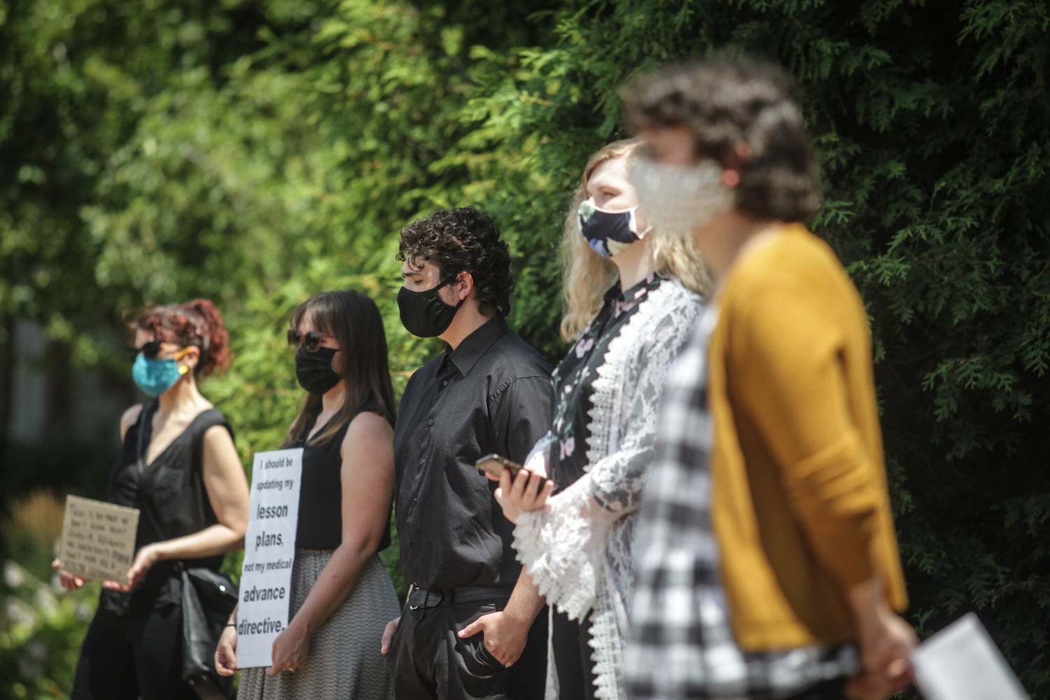 PHOTOS: Professors at the University of Dayton hold demonstration about school opening