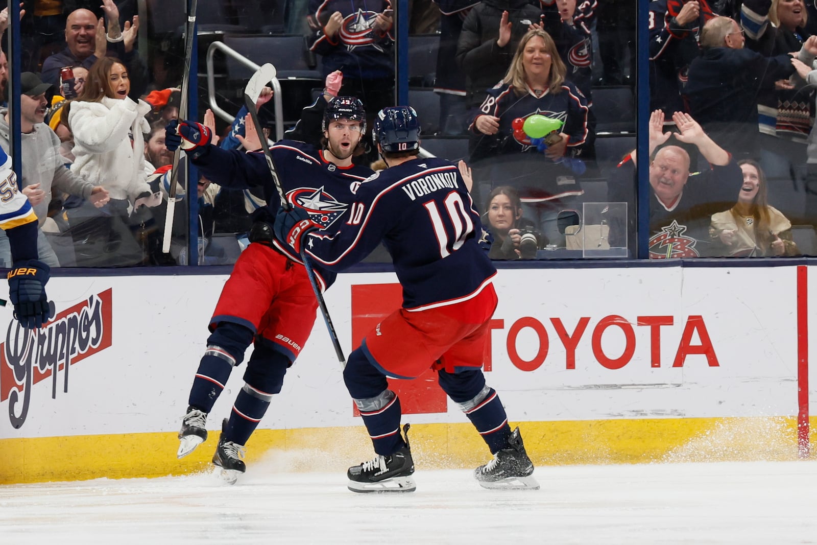 Columbus Blue Jackets' Adam Fantilli, center left, celebrates after his goal against the St. Louis Blues with teammate Dmitri Voronkov during the third period of an NHL hockey game Saturday, Jan. 4, 2025, in Columbus, Ohio. (AP Photo/Jay LaPrete)