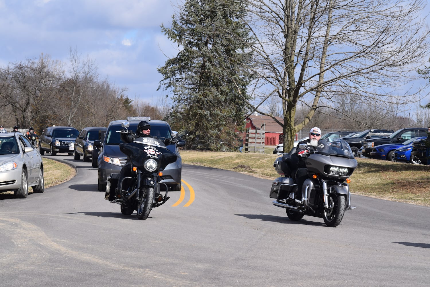 PHOTOS: Thousands of Outlaws attend motorcycle gang leaders funeral at Montgomery County Fairgrounds.