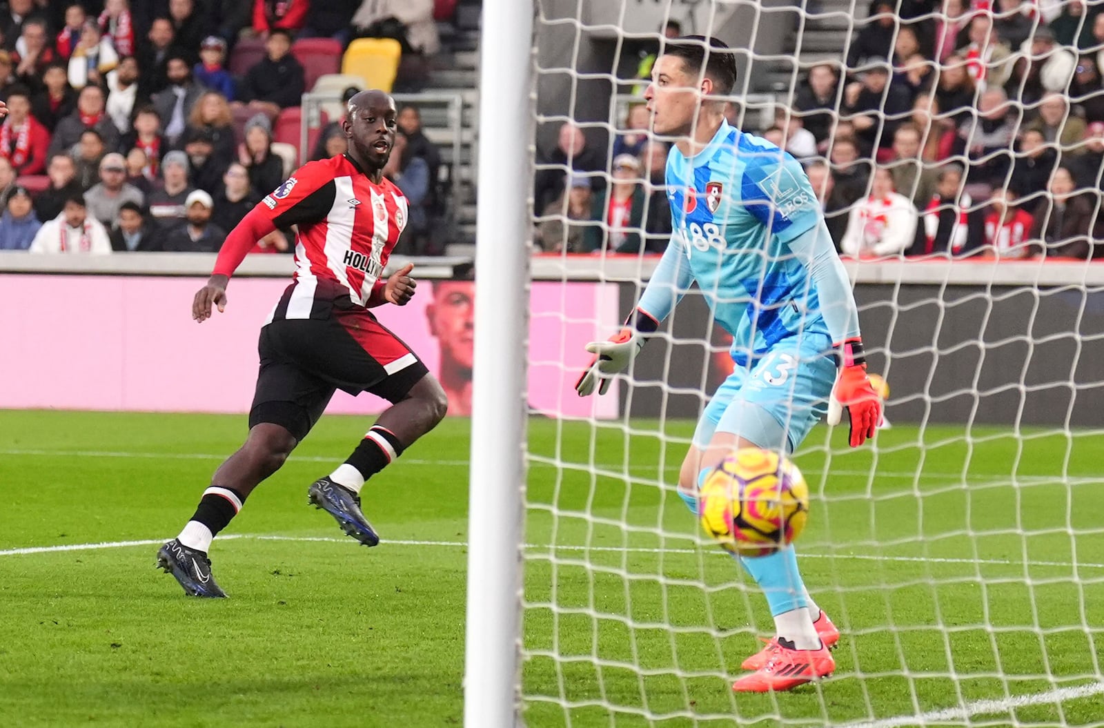 Brentford's Yoane Wissa, left, celebrates scoring their side's first goal of the game during the Premier League match at the Gtech Community Stadium, London, Saturday Nov. 9, 2024. (John Walton/PA via AP)