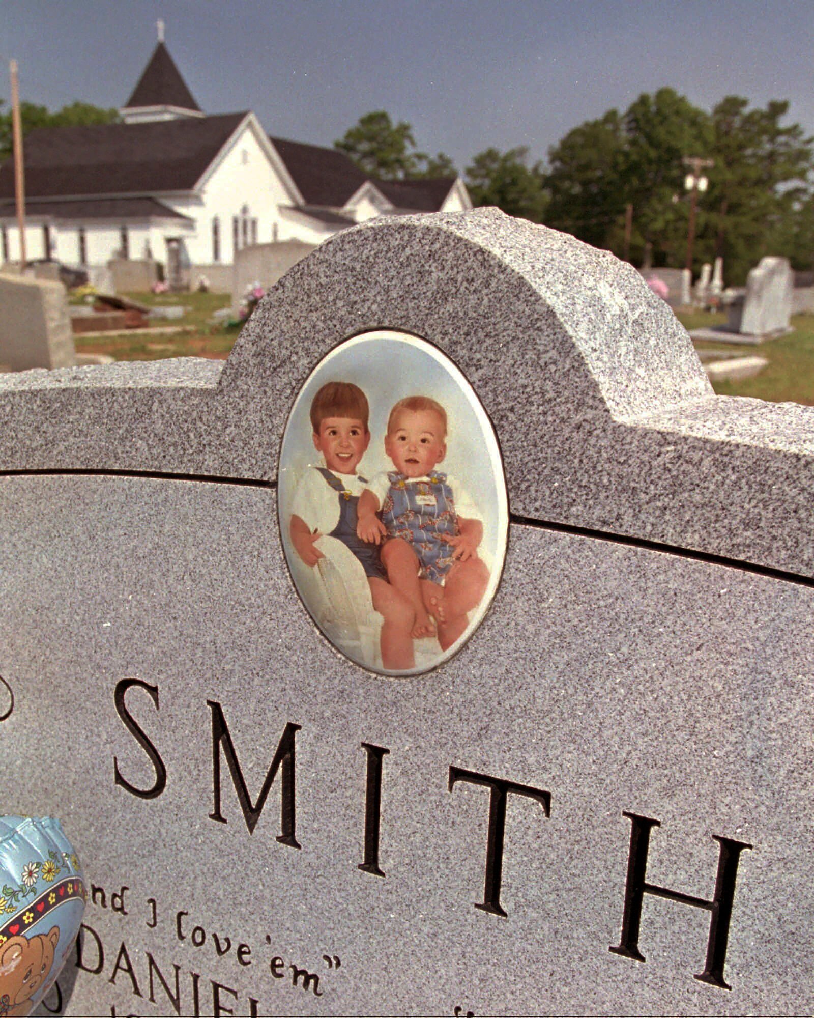 FILE - The grave of Michael and Alex Smith at the Bogansville Methodist Church in West Springs, S.C., July 23, 1995. (AP Photo/Ruth Fremson, file)