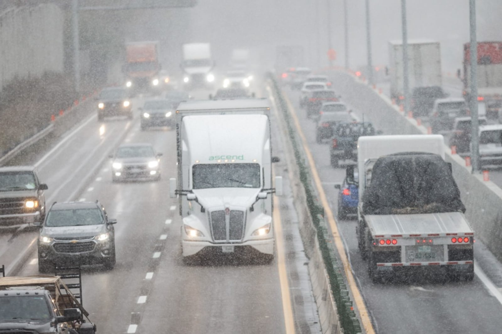 Motorists travel on Interstate 75 near Dayton during a snowsquall Thursday, Nov. 21, 2024. More than 3.2 million Ohioans will travel 50 miles or more away from home for the Thanksgiving holiday this week, 2.1% more than last year. That will make for the highest Thanksgiving travel volume since AAA began tracking in 2000, trailing the record set of 2.4 million in 2005. JIM NOELKER/STAFF