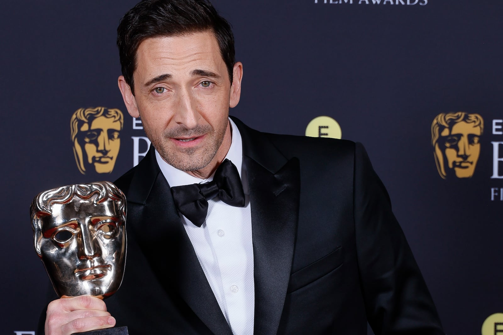 Adrien Brody poses with the leading actor award for 'The Brutalist' at the 78th British Academy Film Awards, BAFTA's, in London, Sunday, Feb. 16, 2025. (Photo by Joel C Ryan/Invision/AP)