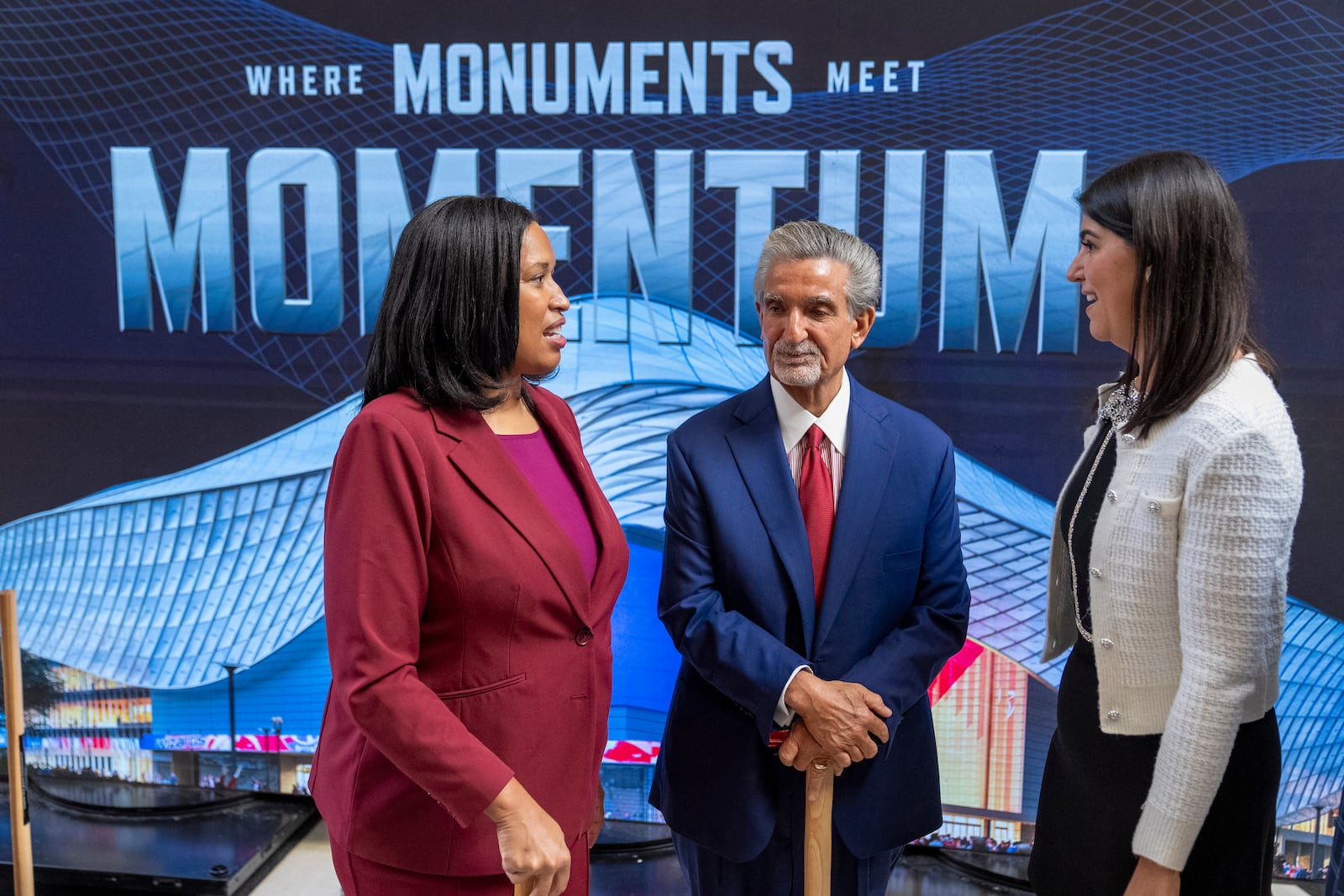 District of Columbia Mayor Muriel Bowser, left, Ted Leonsis, owner of the Washington Wizards NBA basketball team and Washington Capitals NHL hockey team, and District of Columbia Councilmember Brooke Pinto chat after an event announcing the start of work on a new Capital One Arena Gallery Place Atrium, Thursday, Dec. 19, 2024, in Washington. (AP Photo/Jacquelyn Martin)