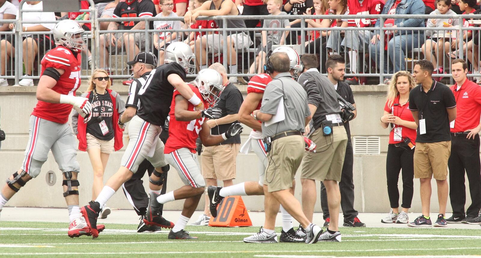 Joe Burrow congratulates Ke’Von Huguely after the two connected on a touchdown in the first half of the spring game on Saturday, April 15, 2017, at Ohio Stadium in Columbus. David Jablonski/Staff