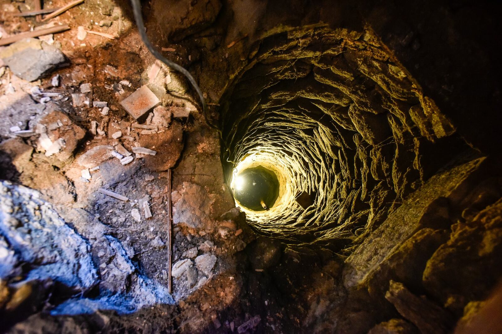 Kimberly Bley, who recently purchased a house at 25 South C Street in Hamilton, found a well nearly 25 feet deep underneath the kitchen floor while renovating. NICK GRAHAM/STAFF