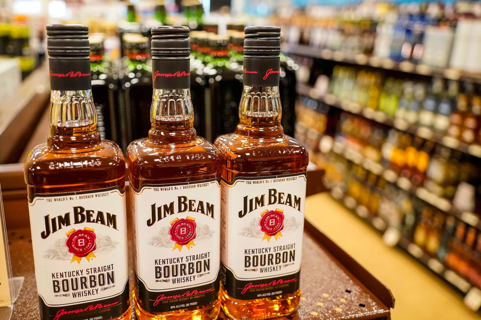 FILE - Shelves display bottles of bourbons for sale at a Pennsylvania fine wine and spirits store, Saturday, Jan. 22, 2022, in Harmony, Pa. (AP Photo/Keith Srakocic, File)