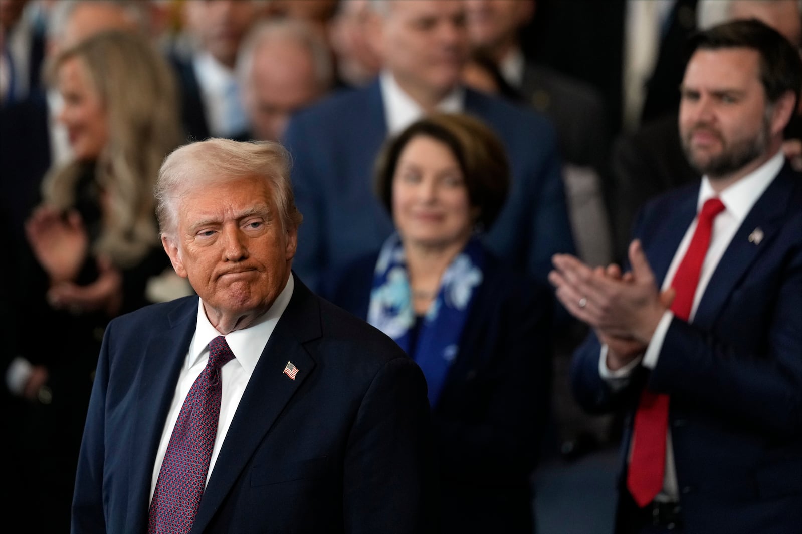 President Donald Trump finishes his inaugural address as Vice President JD Vance applauds during the 60th Presidential Inauguration in the Rotunda of the U.S. Capitol in Washington, Monday, Jan. 20, 2025. (AP Photo/Julia Demaree Nikhinson, Pool)