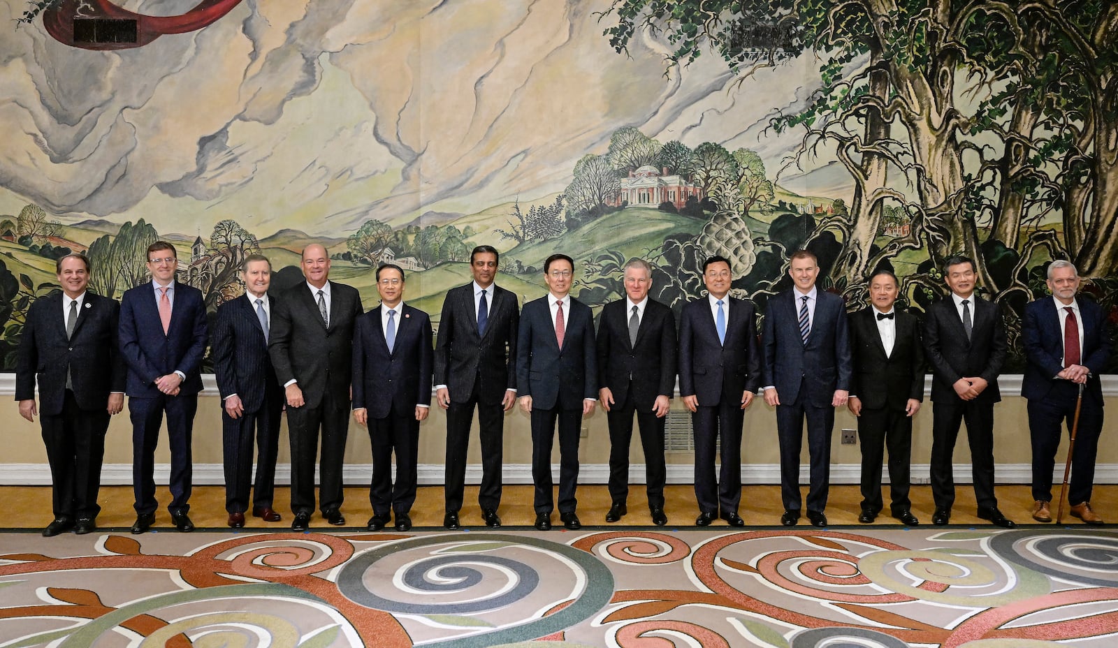 In this photo released by Xinhua News Agency, Chinese Vice President Han Zheng, as Chinese President Xi Jinping's special representative, center, stands for a group photo as he meets with representatives of the U.S. business community in Washington, Sunday, Jan. 19, 2025. (Xinhua/Yin Bogu)