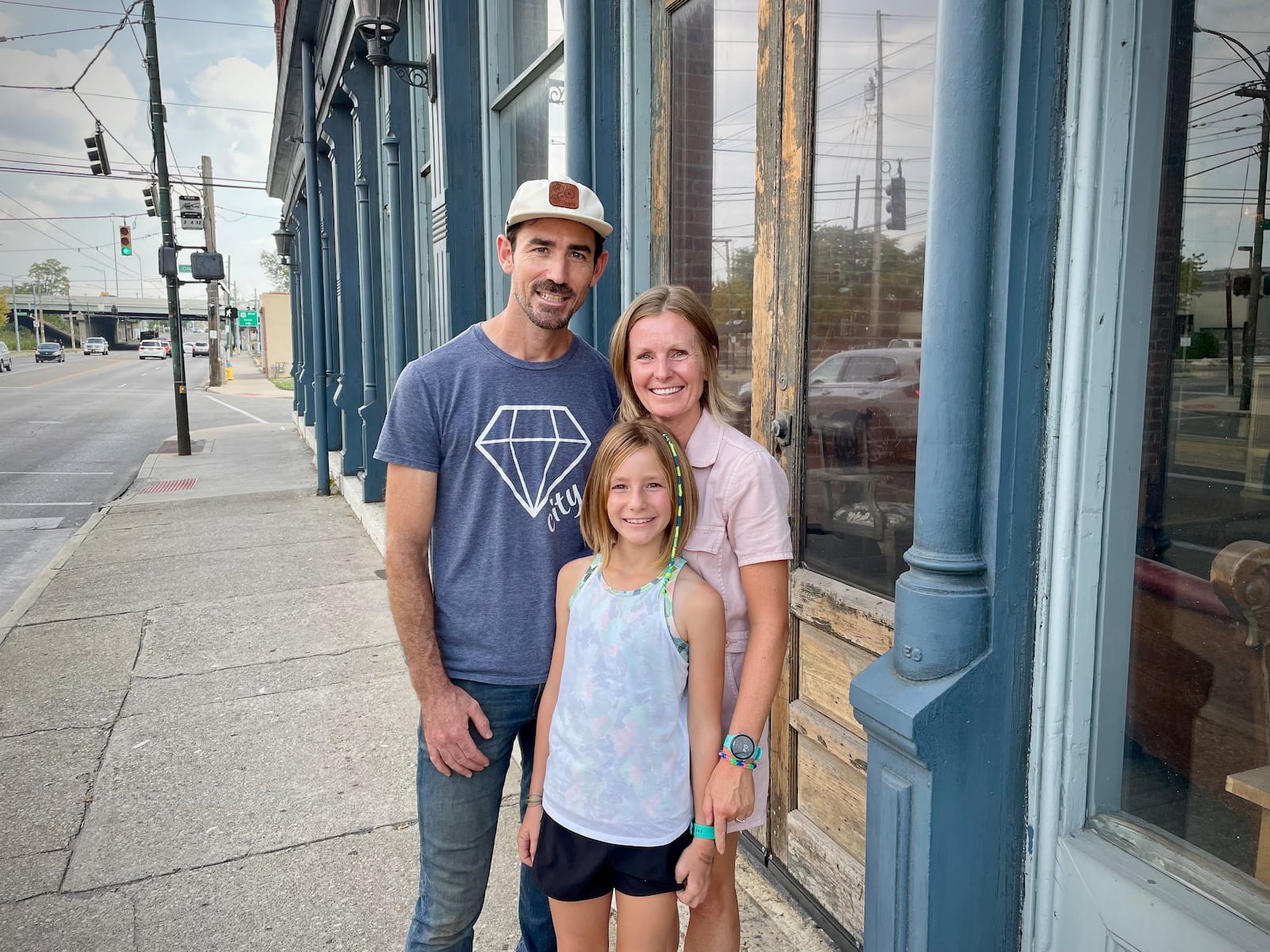 Burgess and Jeanine Gow of 521 LLC have purchased the Dietz Block building on Wayne Avenue in Dayton. Pictured with the couple is their daughter, Kay. NATALIE JONES/STAFF