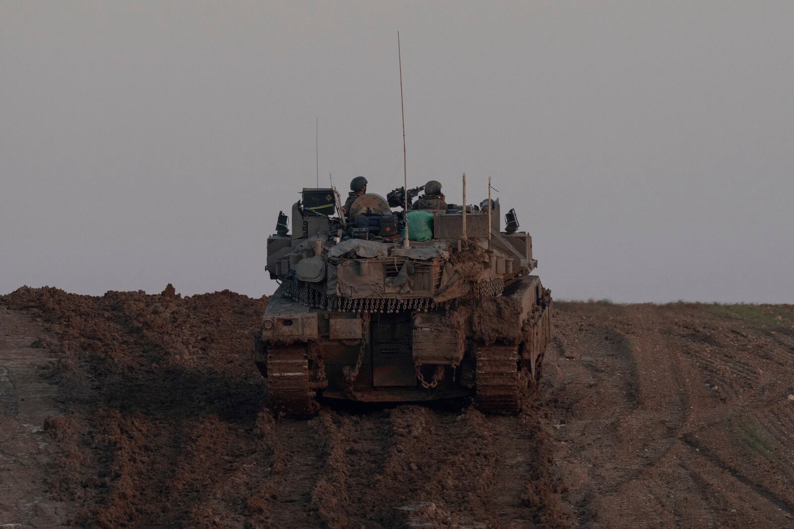 An israeli army vehicle is seen near the Israeli-Gaza border, Wednesday, Jan. 1, 2025. (AP Photo/Ohad Zwigenberg)