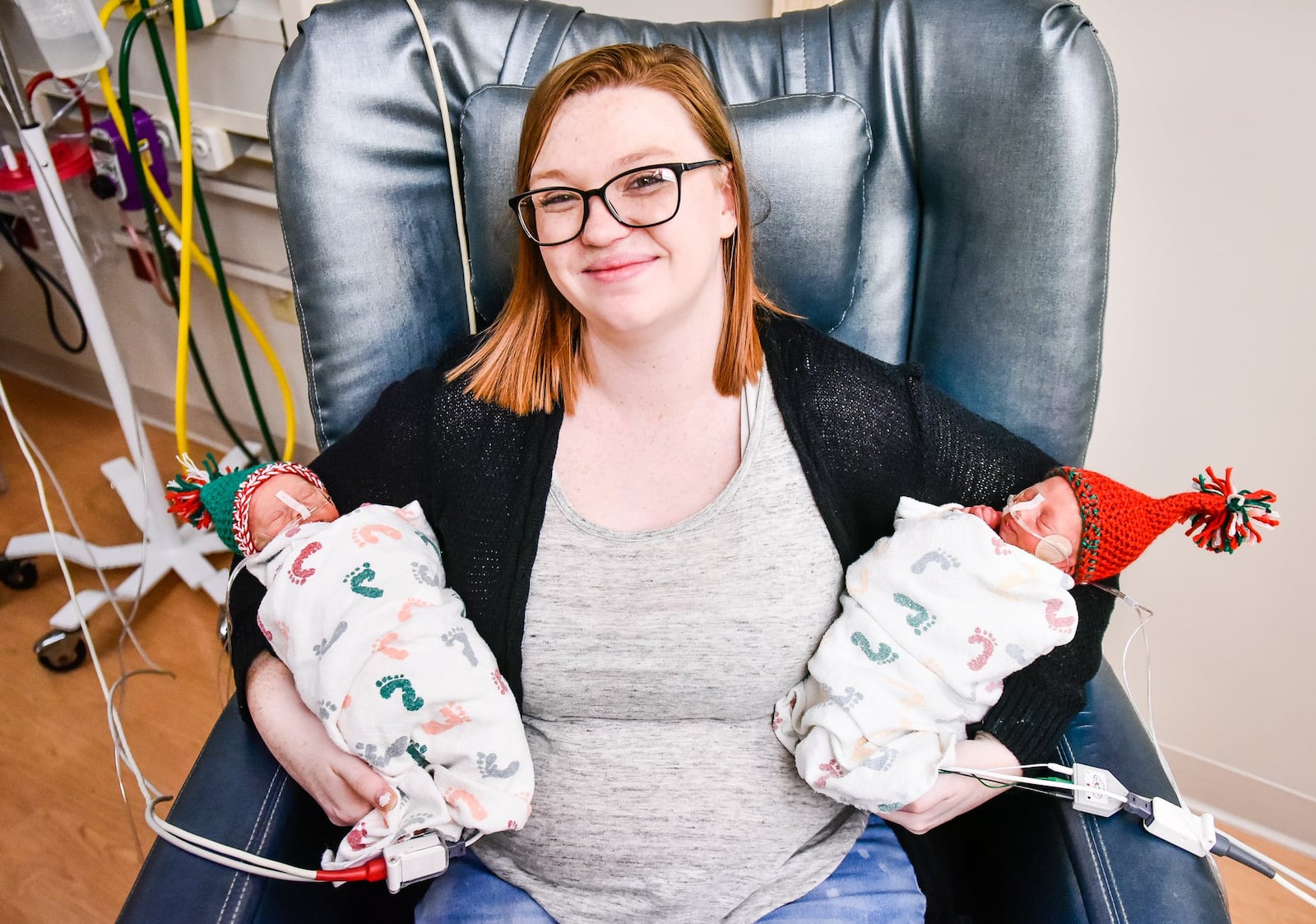 Elyssa Williams holds her sons Grayson Donald Smith, right, and Bradley Wayne Smith Thursday, Dec. 19 in The Berry Women’s Health Pavilion at Miami Valley Hospital in Dayton. The twins were born at 30 weeks to parents Elyssa Williams and Ryan Smith on Dec. 7 and have been in the NICU at the hospital. Grayson and Bradley both weighed 2 lbs,15oz. at birth. NICK GRAHAM/STAFF