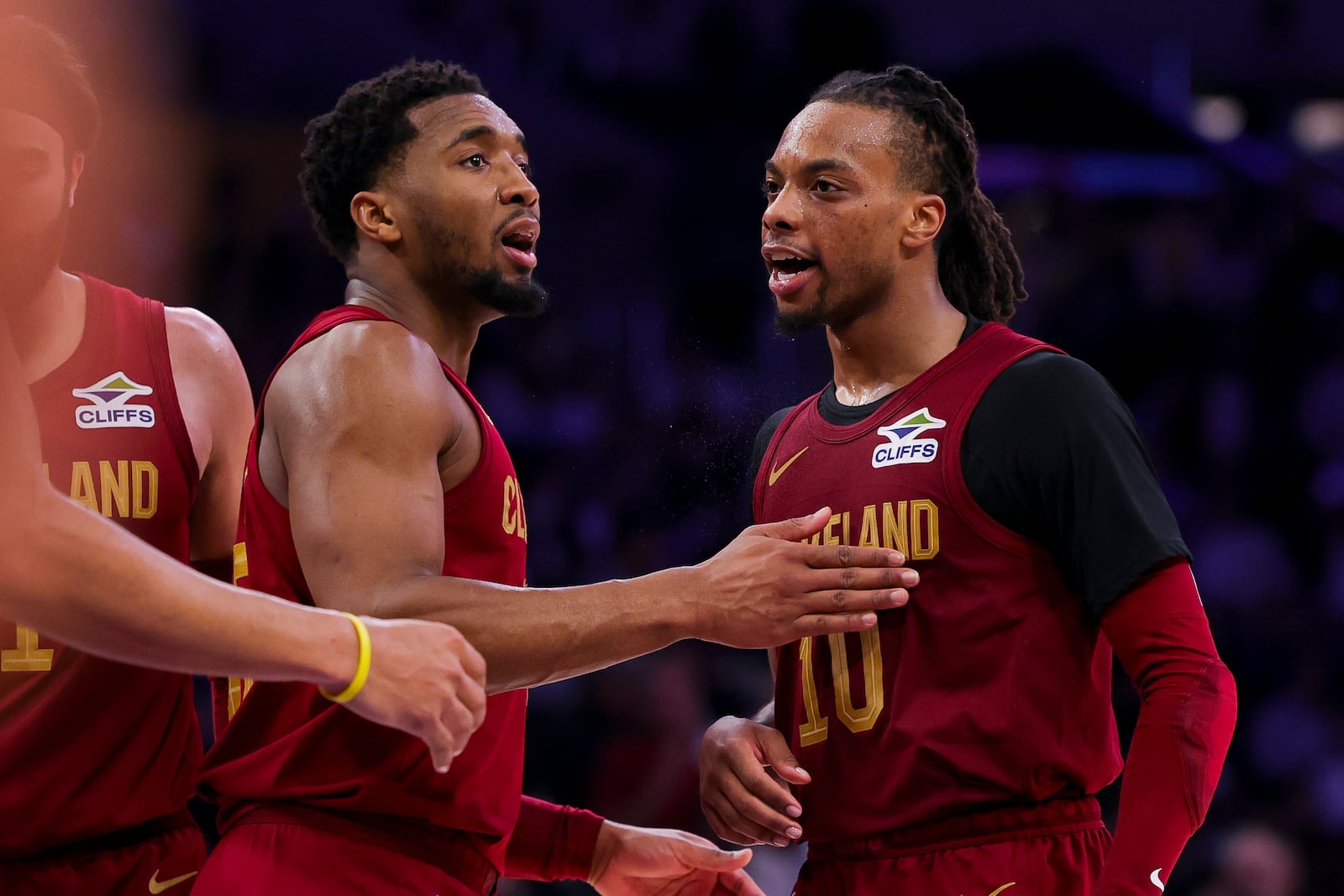 Cleveland Cavaliers guards Donovan Mitchell, left, and Darius Garland celebrate after the team's win against the Los Angeles Lakers during an NBA basketball game Tuesday, Dec. 31, 2024, in Los Angeles. (AP Photo/Ryan Sun)