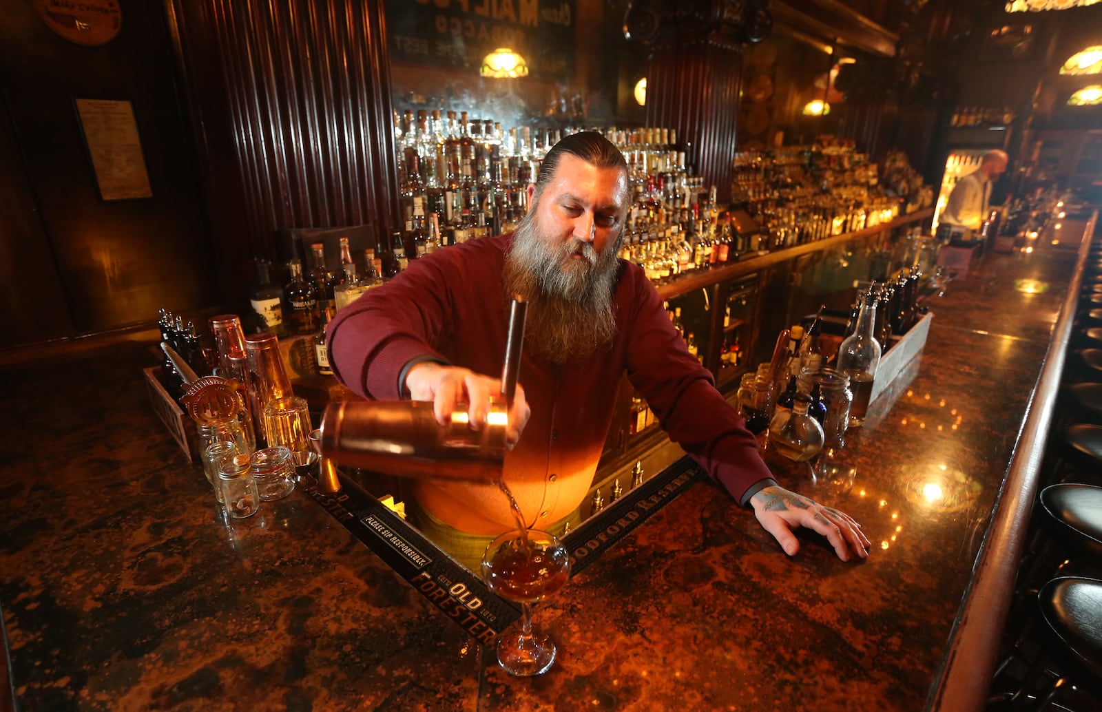 Joe Head co-owns the Century Bar in downtown Dayton with Diane Spitzig. LISA POWELL / STAFF