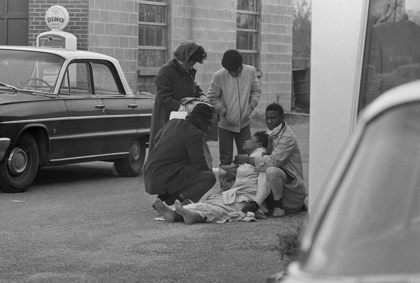 FILE - Amelia Boynton is aided by people after she was injured when state police broke up a demonstration march in Selma, Ala., March 7, 1965. Boynton, wife of a real estate and insurance man, has been a leader in civil rights efforts. (AP Photo, File)