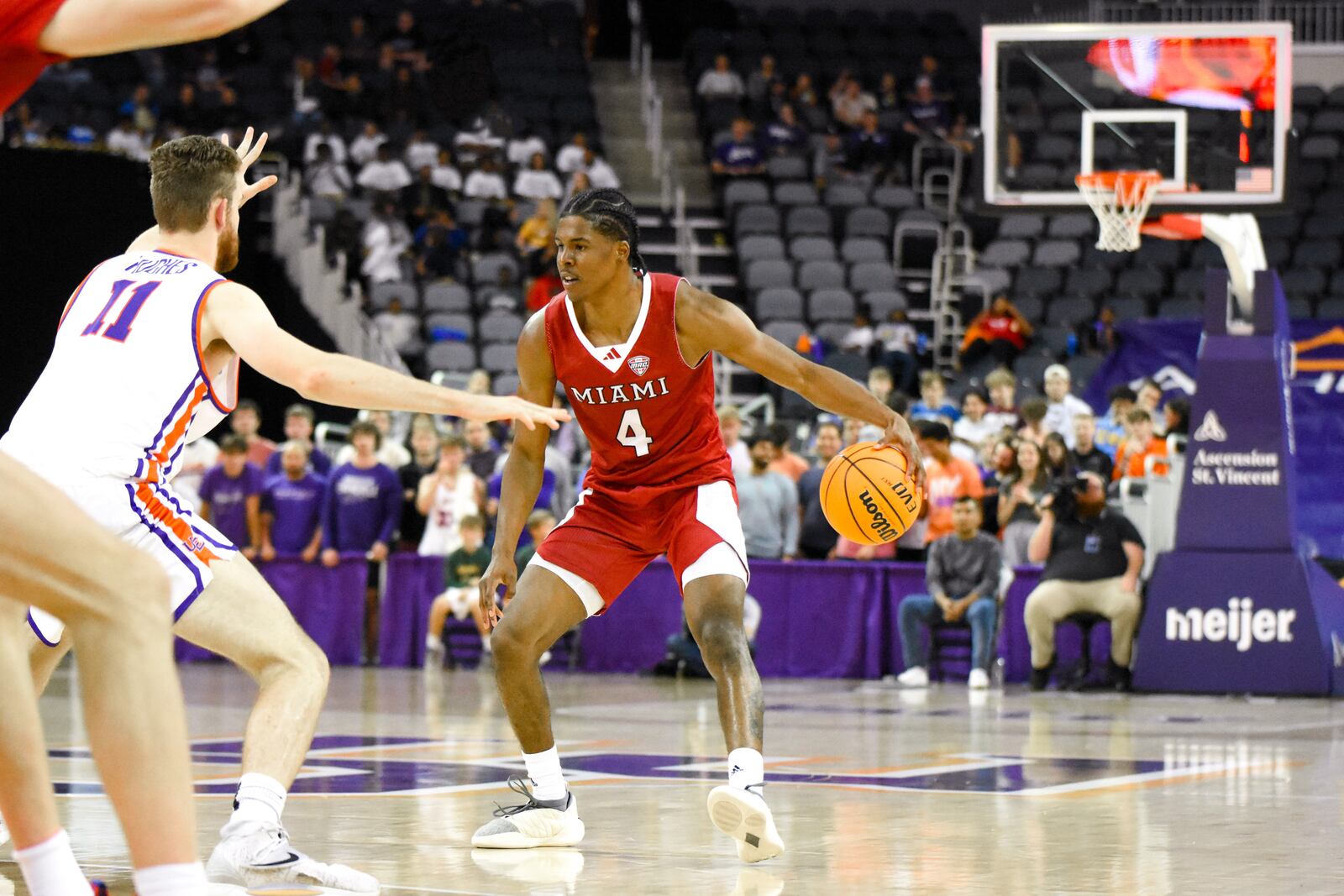 Miami's Darweshi Hunter vs. Evansville in Monday's season opener. Megan Walker/CONTRIBUTED