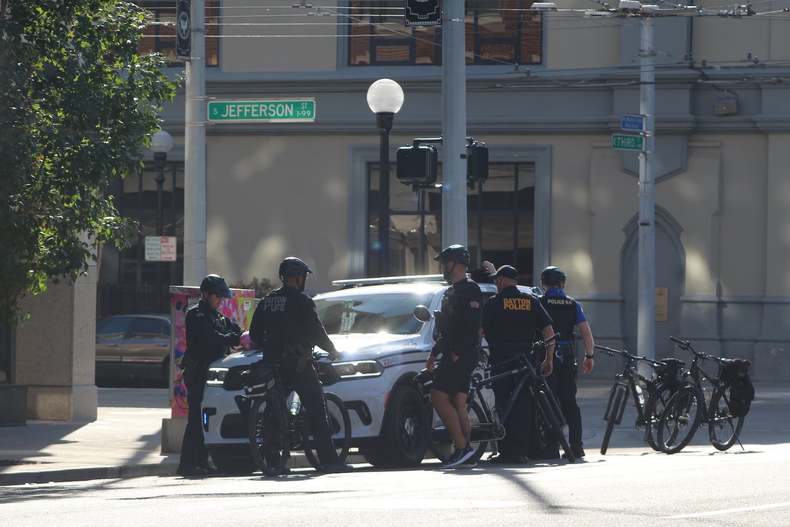 Dayton police officers at East Third Street, near the Jefferson Street intersection. Officials say the area around the Greater Dayton RTA bus hub has safety issues that are being caused by high school students who ride the buses and others. CORNELIUS FROLIK / STAFF