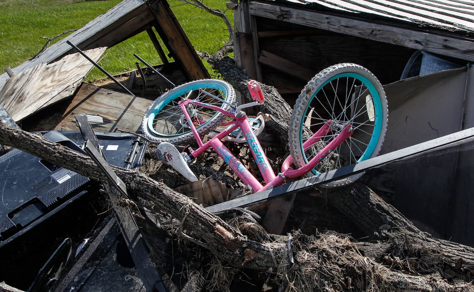 Tornado debris, including this child's bike, is seen outside the Woodland Hills apartments five months after a powerful EF4 twister damaged the Trotwood complex. CHRIS STEWART / STAFF