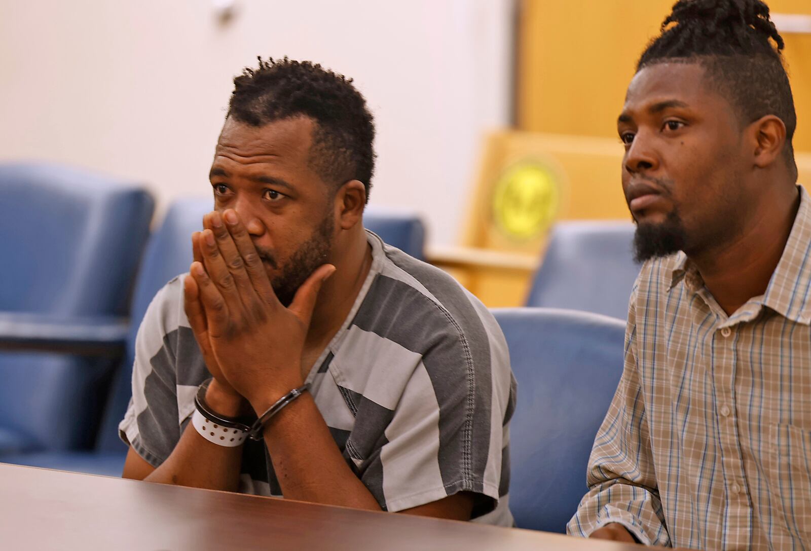 Hermanio Joseph, left, sits with interpreter, Sony Auguste, as he's arraigned in Clark County Municipal Court Thursday, August 24, 2023. Joseph is charged with vehicular homicide for causing the fatal Northwestern school bus crash on Tuesday. BILL LACKEY/STAFF