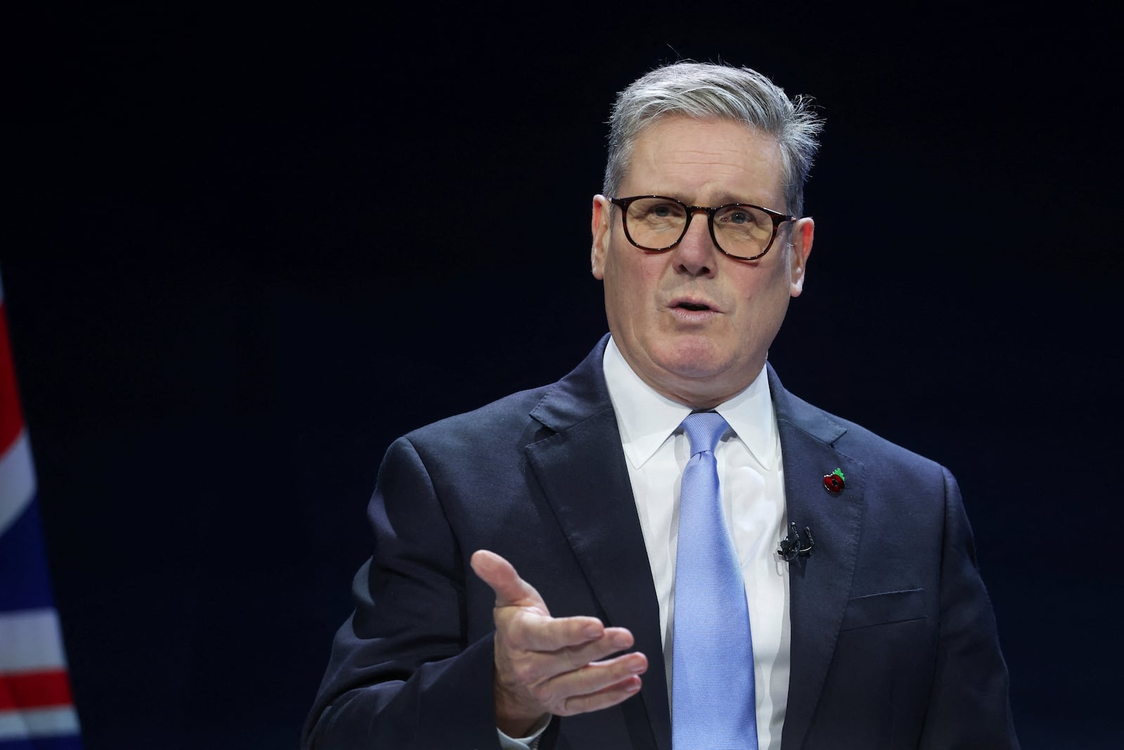 British Prime Minister Keir Starmer delivers a speech at the Interpol General Assembly in Glasgow, Scotland, Britain, Monday, Nov. 4, 2024. (Russell Cheyne/Pool Photo via AP)