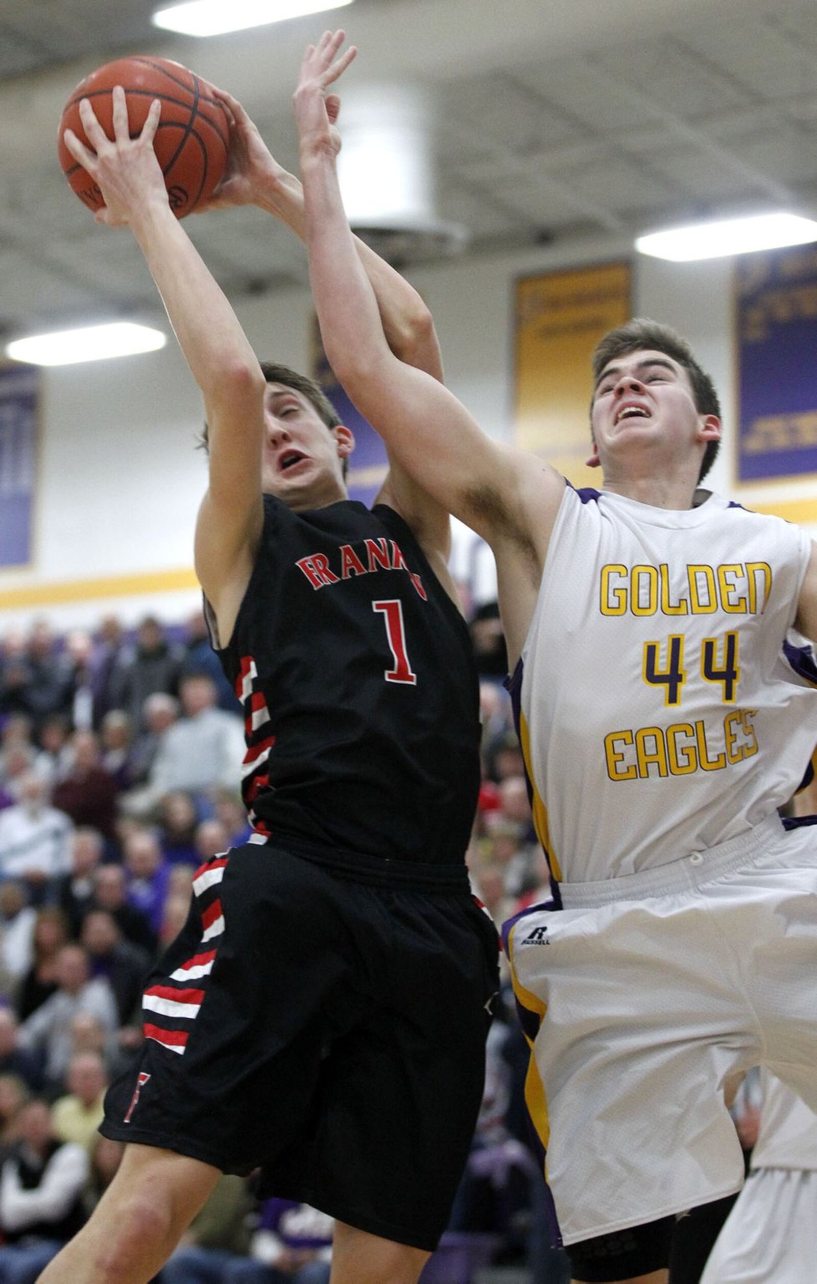 Franklin’s Austin Doliboa pulls down a rebound against Bellbrook’s Josh Rogers on Feb. 7, 2014, at Bellbrook. TY GREENLEES/STAFF