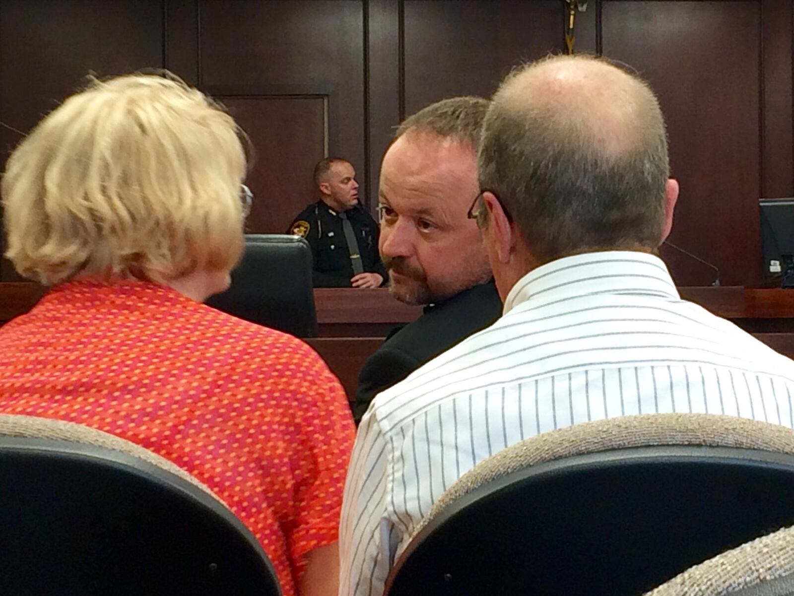 Douglas Gearhart talking to his family in court Friday before he waived his preliminary hearing.