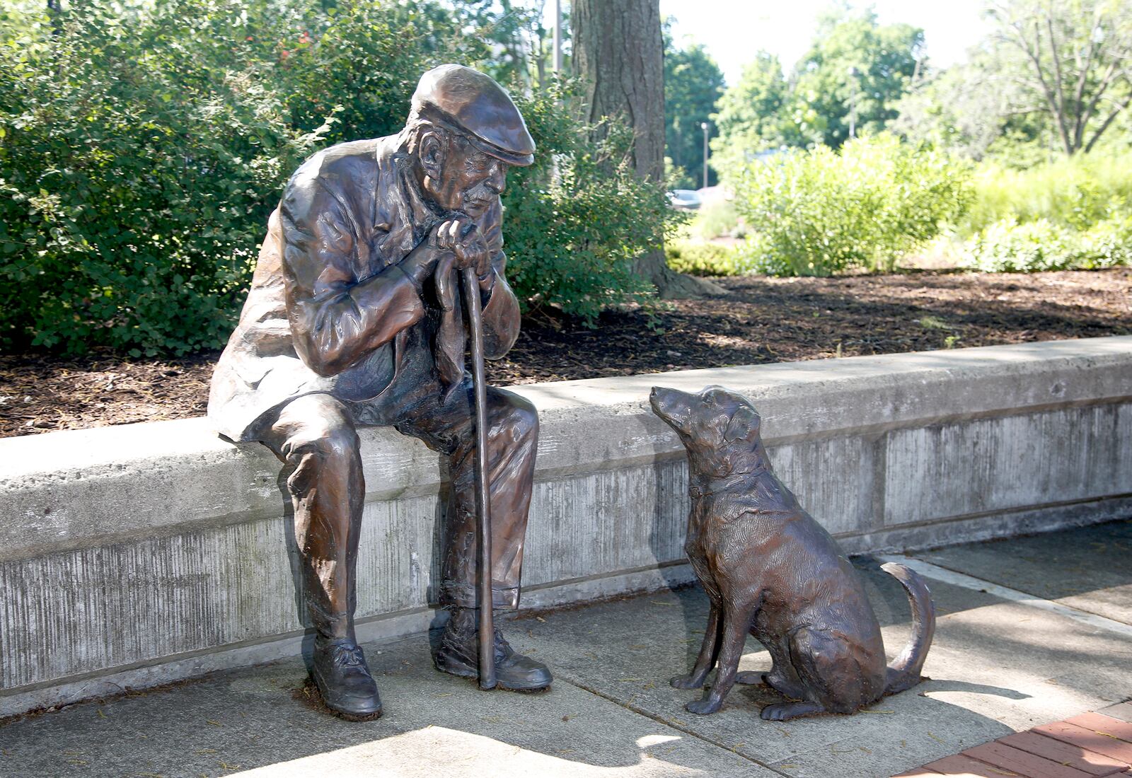 Kettering's Lincoln Park Civic Commons is home to five pieces of public art.  Kettering  currently has 27 sculptures on display throughout the city. "Old Man and His Dog," is made of bronze and created by Glenna Goodacre.  LISA POWELL / STAFF