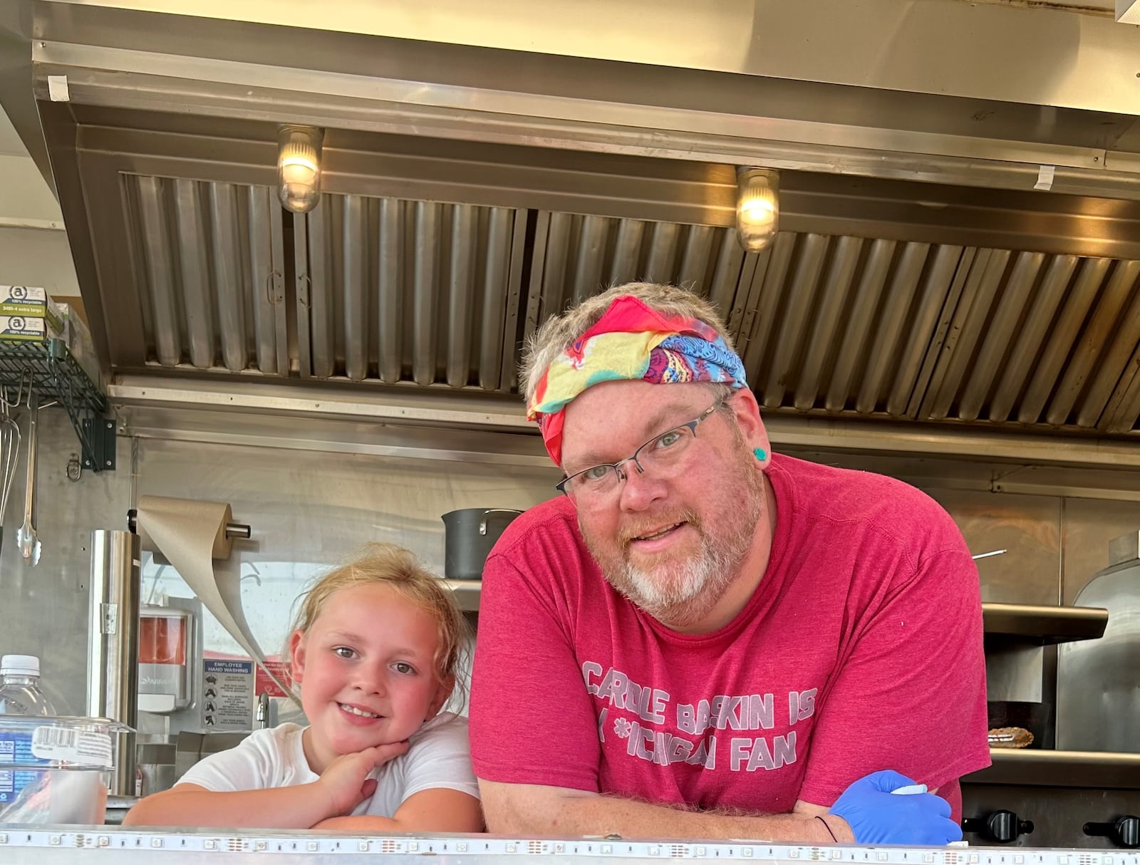 The Director’s Cut Food Truck is now serving wraps outside of the Fairborn Phoenix at 34 S. Broad St. Pictured is owner Jonathan Gum (right) with his daughter, Giana. CONTRIBUTED