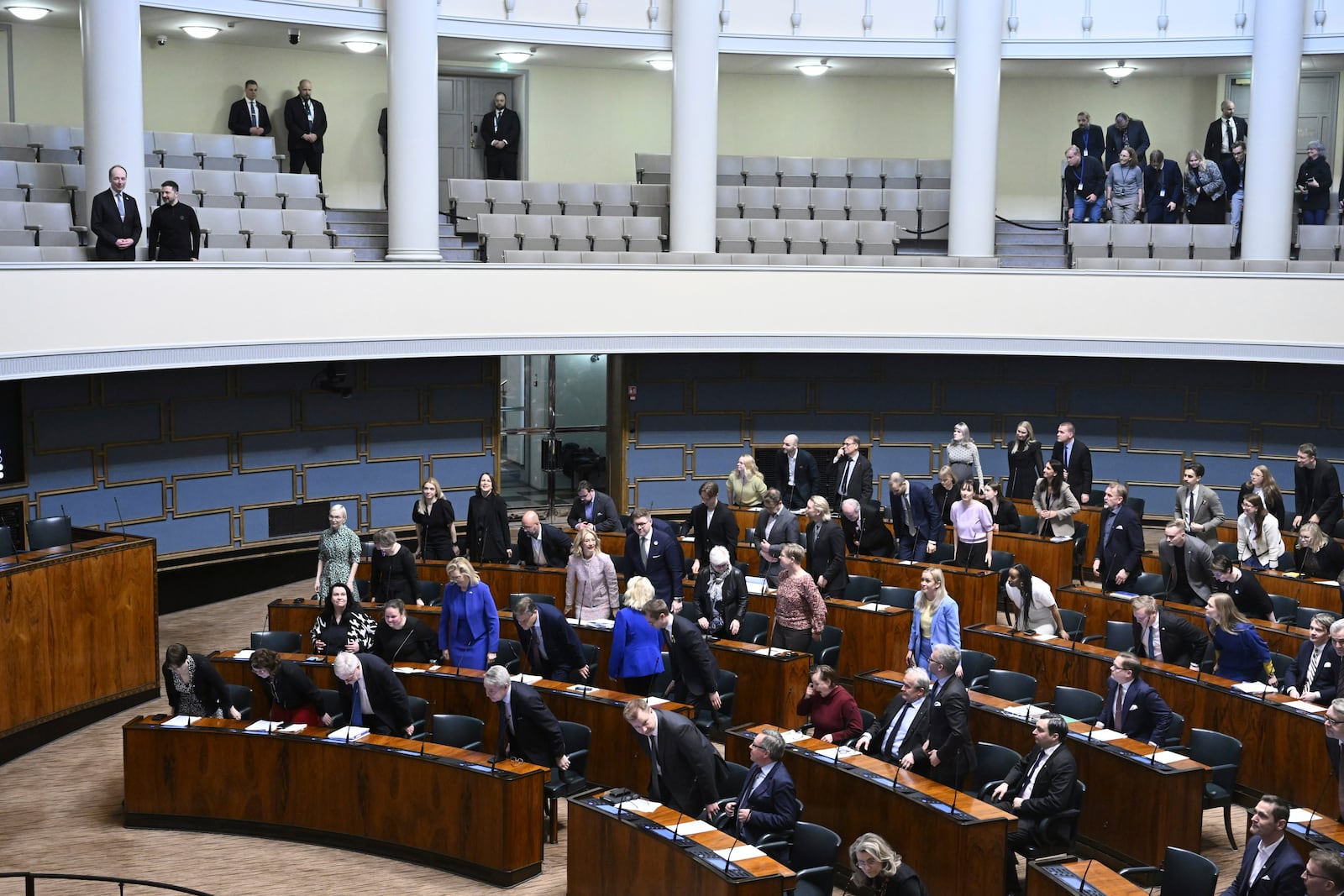 Ukrainian President Volodymyr Zelenskyy, second left in the gallery with Speaker of Parliament Jussi Halla-aho during his visit to the Parliament, in Helsinki, Finland, Wednesday, March 19, 2025. (Heikki Saukkomaa/Lehtikuva via AP)