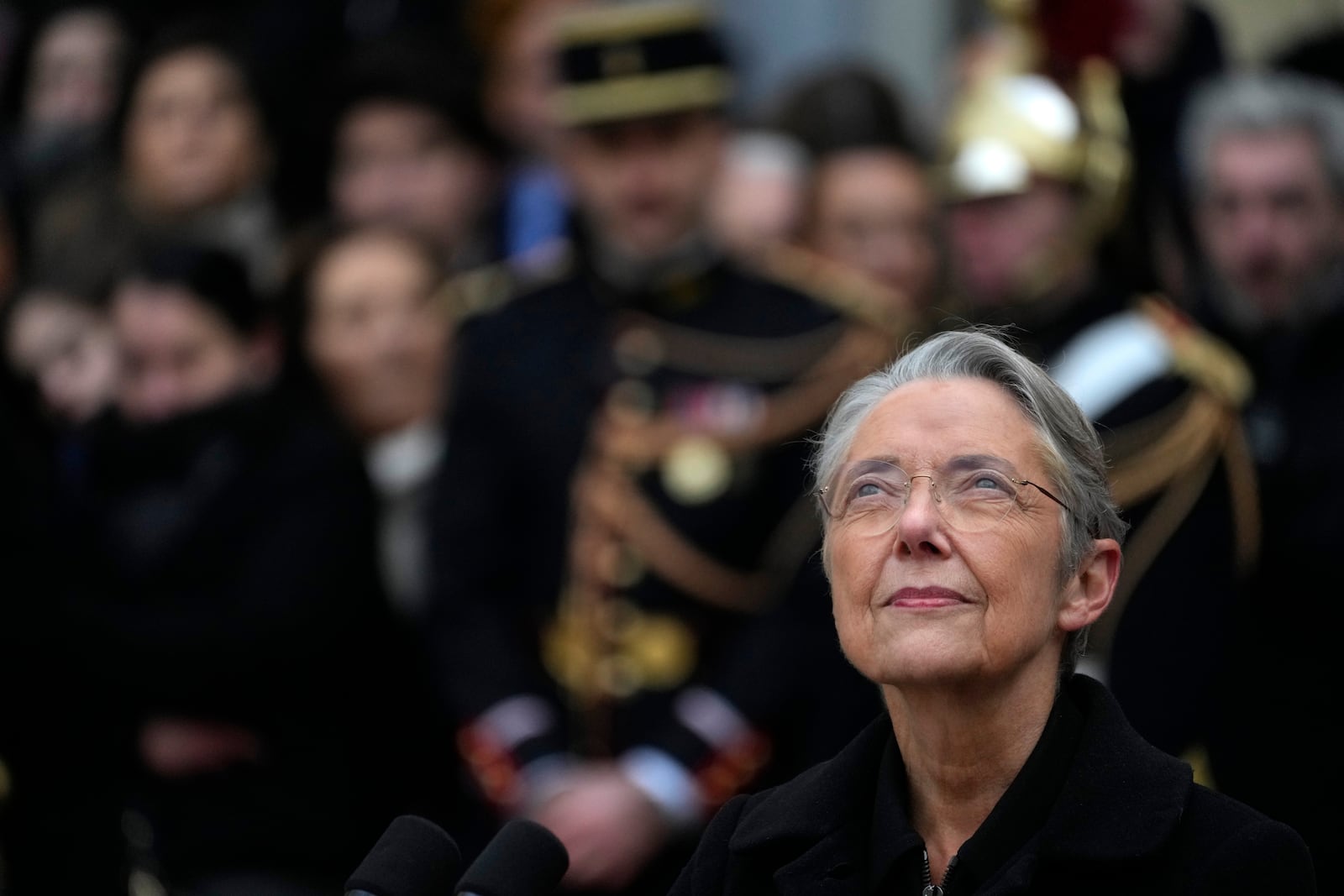 FILE - Outgoing French Prime Minister Elisabeth Borne looks up after the handover ceremony, Tuesday, Jan. 9, 2024 in Paris. (AP Photo/Thibault Camus, File)