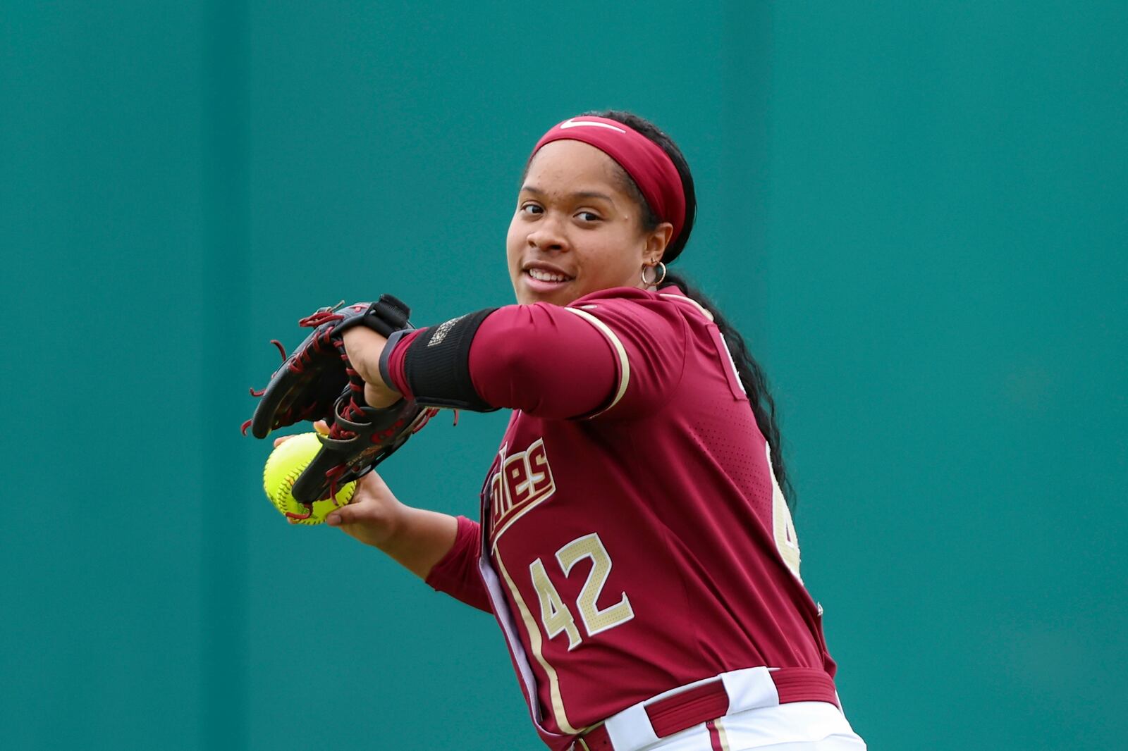 FILE - Florida State infielder Jaysoni Beachum (42) warms up before an NCAA softball regional game against Central Florida, Saturday, May 18, 2024, in Tallahassee, Fla. (AP Photo/Gary McCullough, File)