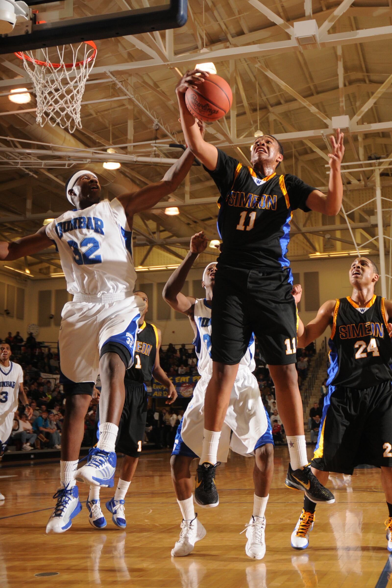 Jabari Parker of Simeon (Chicago IL) battles for a rebound against Dayton Dunbars (OH)Gary Akbar in the last game of Sundays Flyin to the Hoop