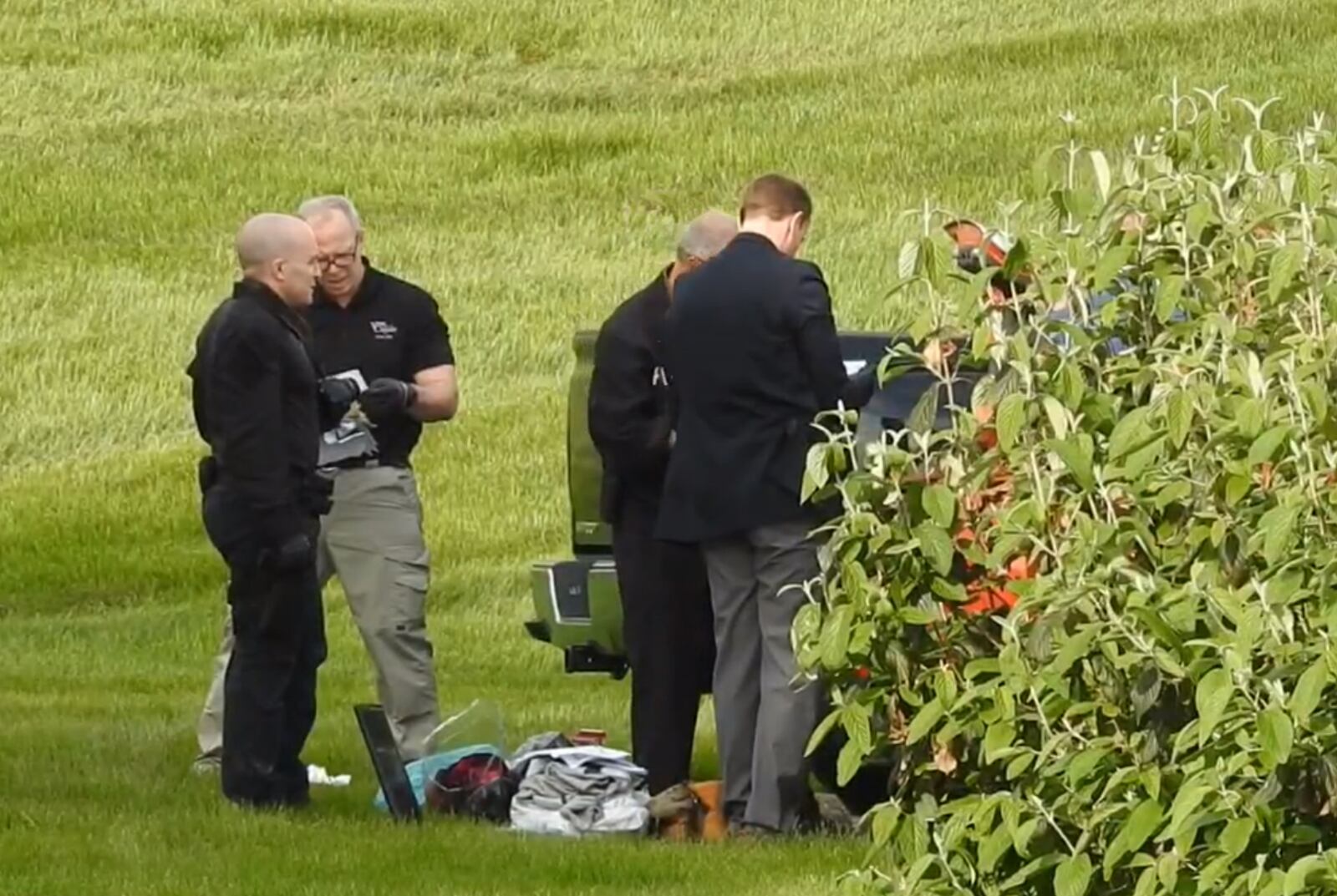 Police search a vehicle in the Beckett Meadows Condominium community on Friday afternoon, May 3, in relation to the quadruple homicide on April 28. NICK GRAHAM/STAFF