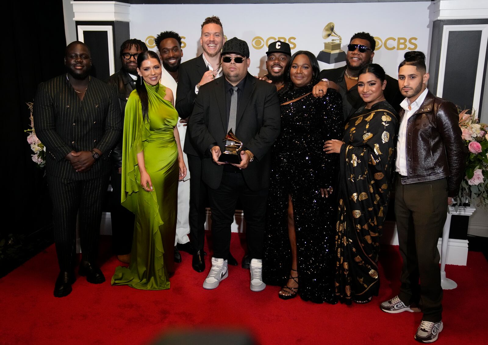 Elevation Worship and Maverick City Music, winners of the award for best contemporary christian music album for "Old Church Basement," pose in the press room at the 64th Annual Grammy Awards at the MGM Grand Garden Arena on Sunday, April 3, 2022, in Las Vegas. Elevation Worship will appear Aug. 12 at the Nutter Center. (AP Photo/John Locher)