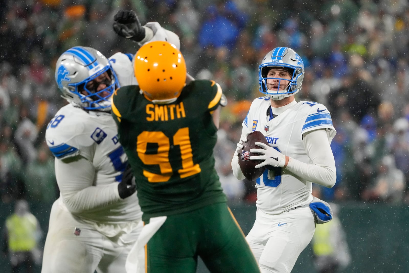 Detroit Lions quarterback Jared Goff (16) prepares to pass during the second half of an NFL football game against the Green Bay Packers, Sunday, Nov. 3, 2024, in Green Bay, Wis. (AP Photo/Morry Gash)