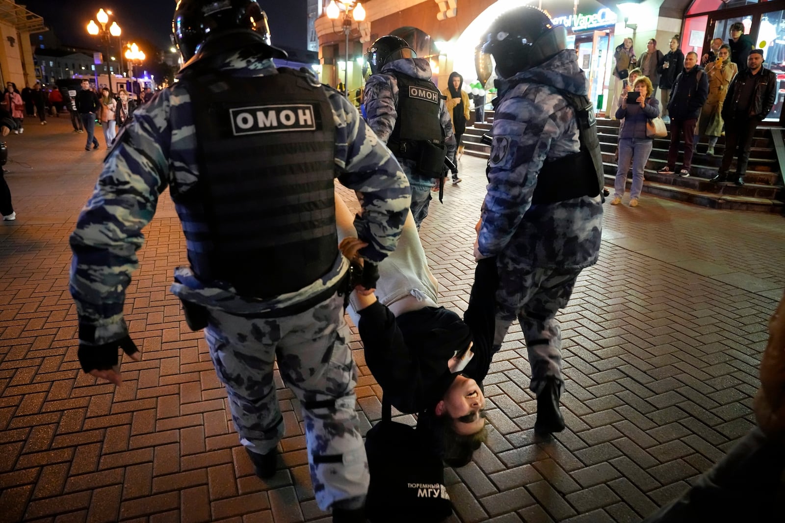 FILE - Riot police detain a demonstrator during a protest of the mobilization of reservists for fighting in Ukraine, in Moscow, Sept. 21, 2022. (AP Photo, File)