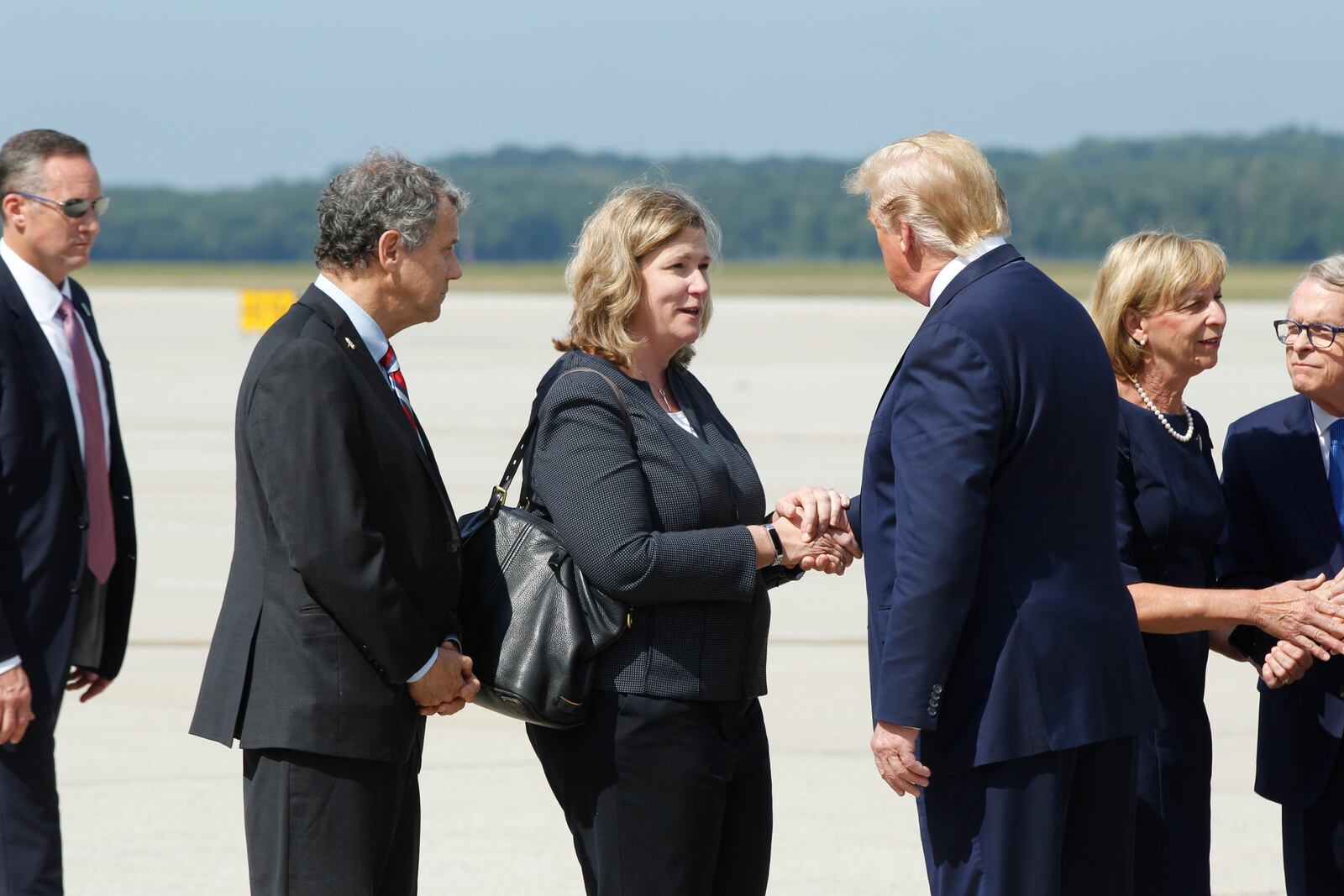 President Trump greets Dayton Mayor Nan Whaley at Wright Patterson Air Force Base, Wednesday, Aug. 7, 2019, in Dayton, Ohio. (Ty Greenlees/Dayton Daily News/pool)